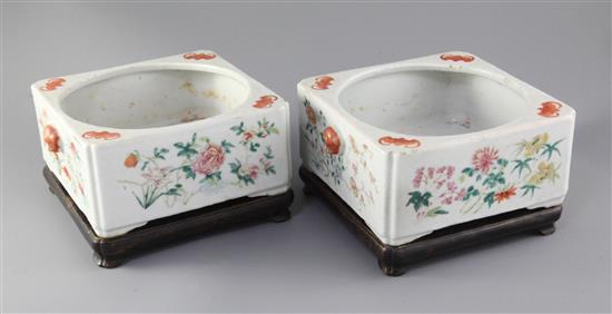 A pair of Chinese famille rose square narcissus pots, 19th century, total width 22cm height 9cm, rosewood stands